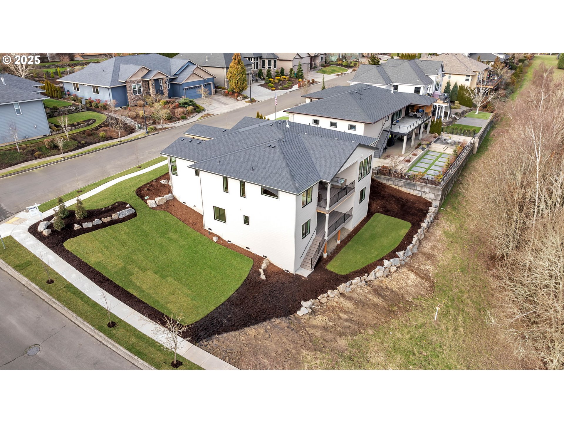 718 South 15th Court Ridgefield, WA 98642 - Photo 43 of 47 a view of a tennis ground with large trees