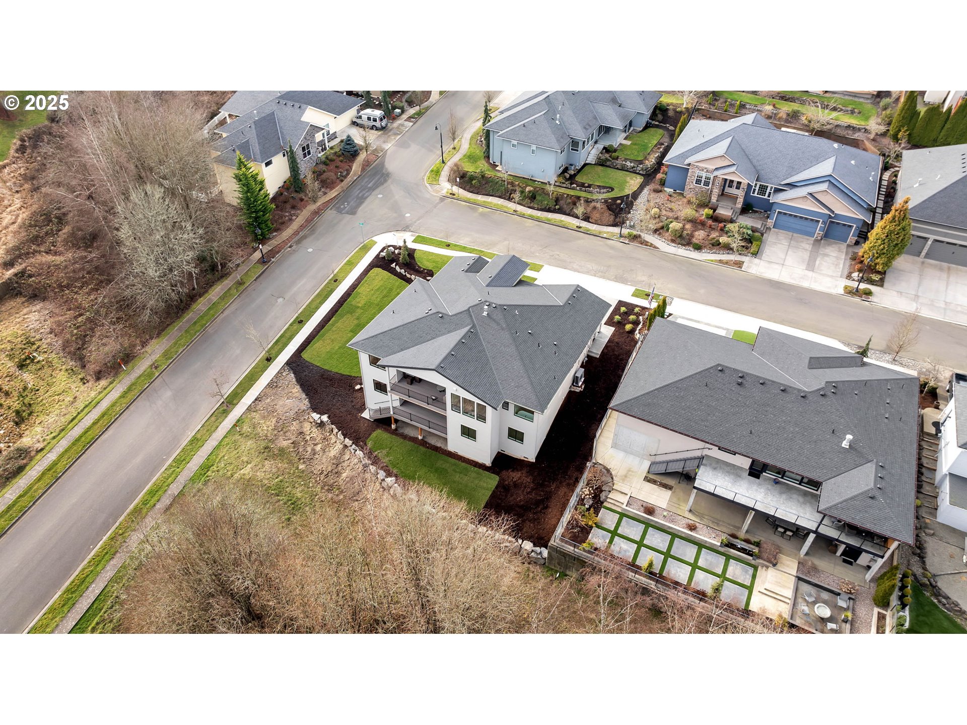 718 South 15th Court Ridgefield, WA 98642 - Photo 45 of 47 a aerial view of a house with a garden and mountain view
