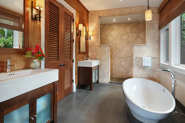 a bathroom with a sink double vanity and a mirror