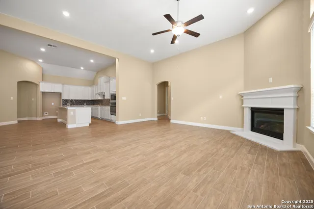 a view of a kitchen with a sink and a fireplace