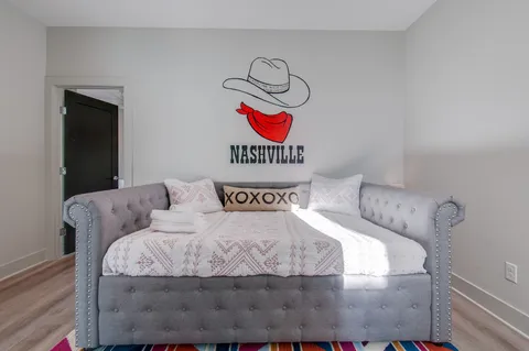 a bedroom with a bed and a couch