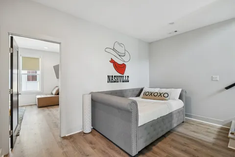 a bedroom with bed and cabinets