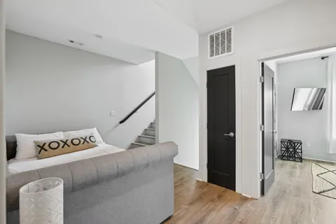 a bedroom with a bed and a view of bathroom
