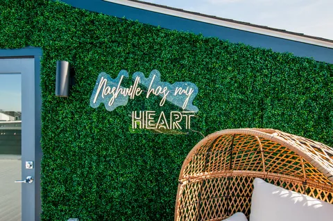 a view of a wooden fence next to a yard