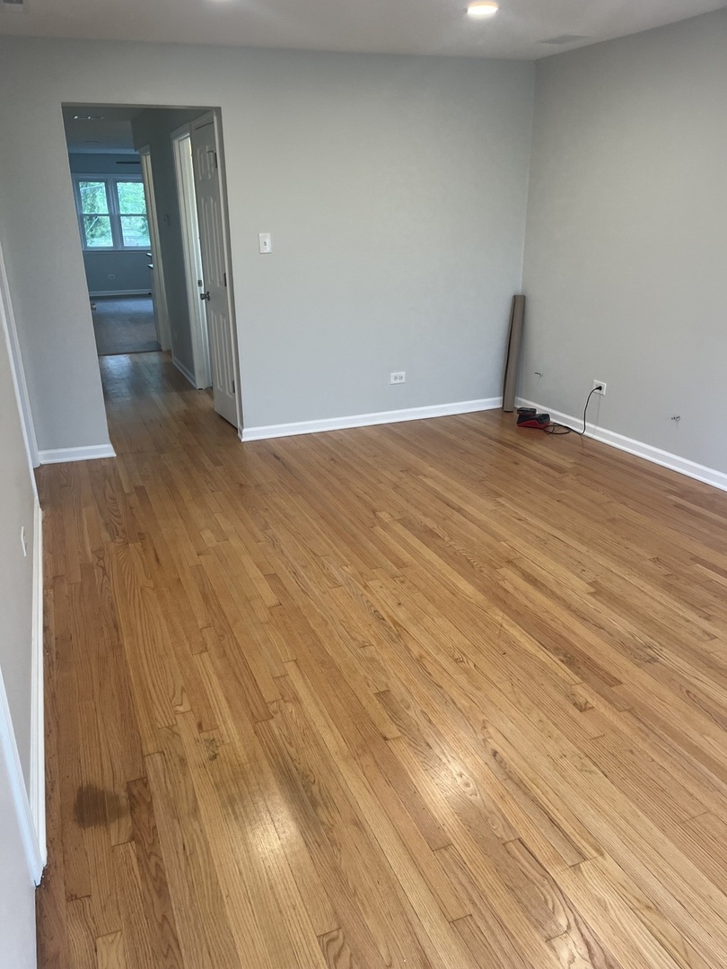 4543 West Marquette Road, Unit 2 Chicago, IL 60629 - Photo 3 of 12 a view of empty room with wooden floor