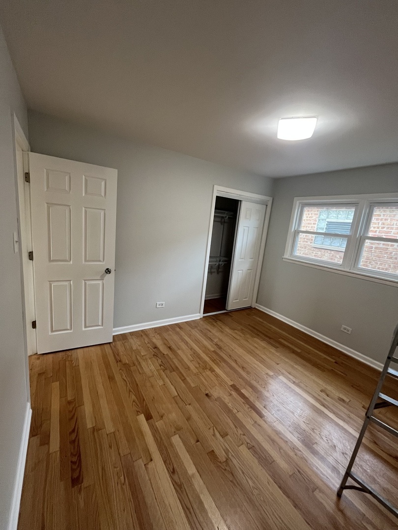 4543 West Marquette Road, Unit 2 Chicago, IL 60629 - Photo 5 of 12 a view of empty room with wooden floor