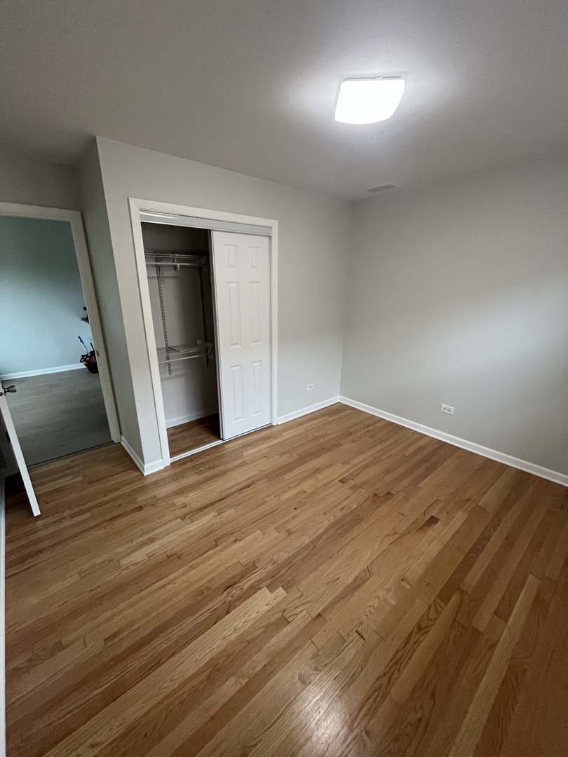 4543 West Marquette Road, Unit 2 Chicago, IL 60629 - Photo 6 of 12 a view of empty room with wooden floor