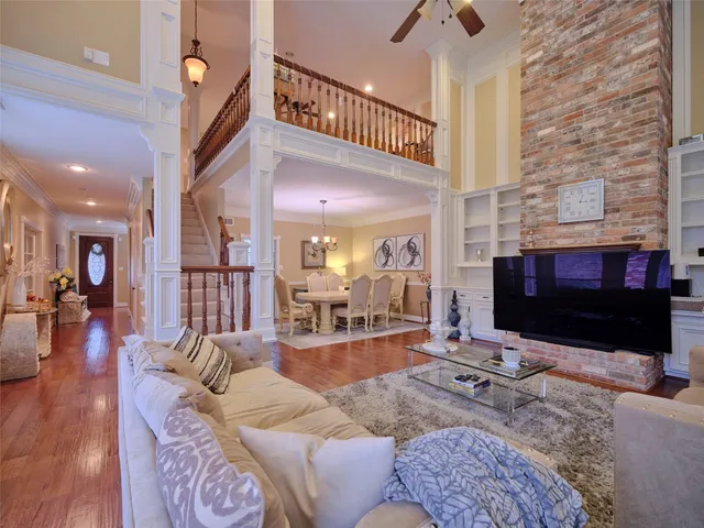 a living room with furniture flat screen tv and a fireplace