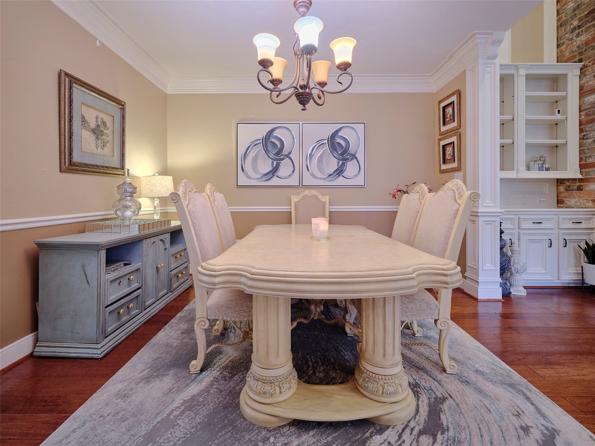 16623 Manningtree Lane Spring, TX 77379 - Photo 16 of 39 Elegant dining room featuring a mix of warm wood and light cabinets, creating a cozy yet sophisticated atmosphere.