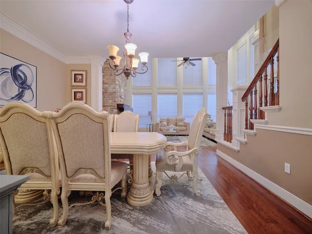 a living room with a couch and wooden floor