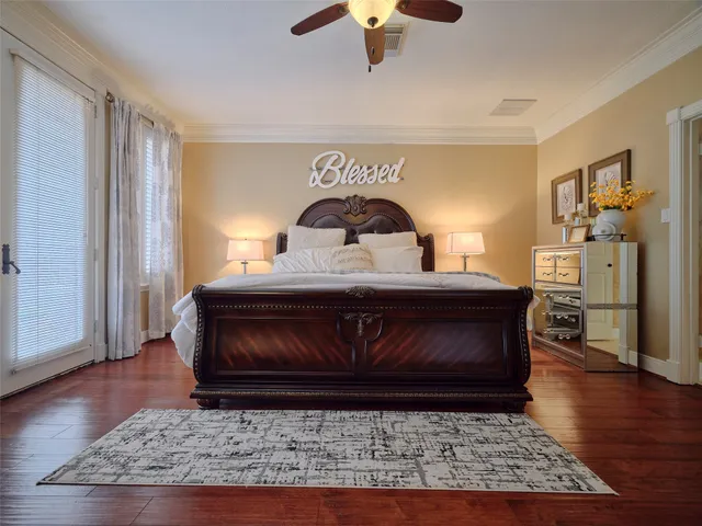 a bedroom with furniture and a chandelier