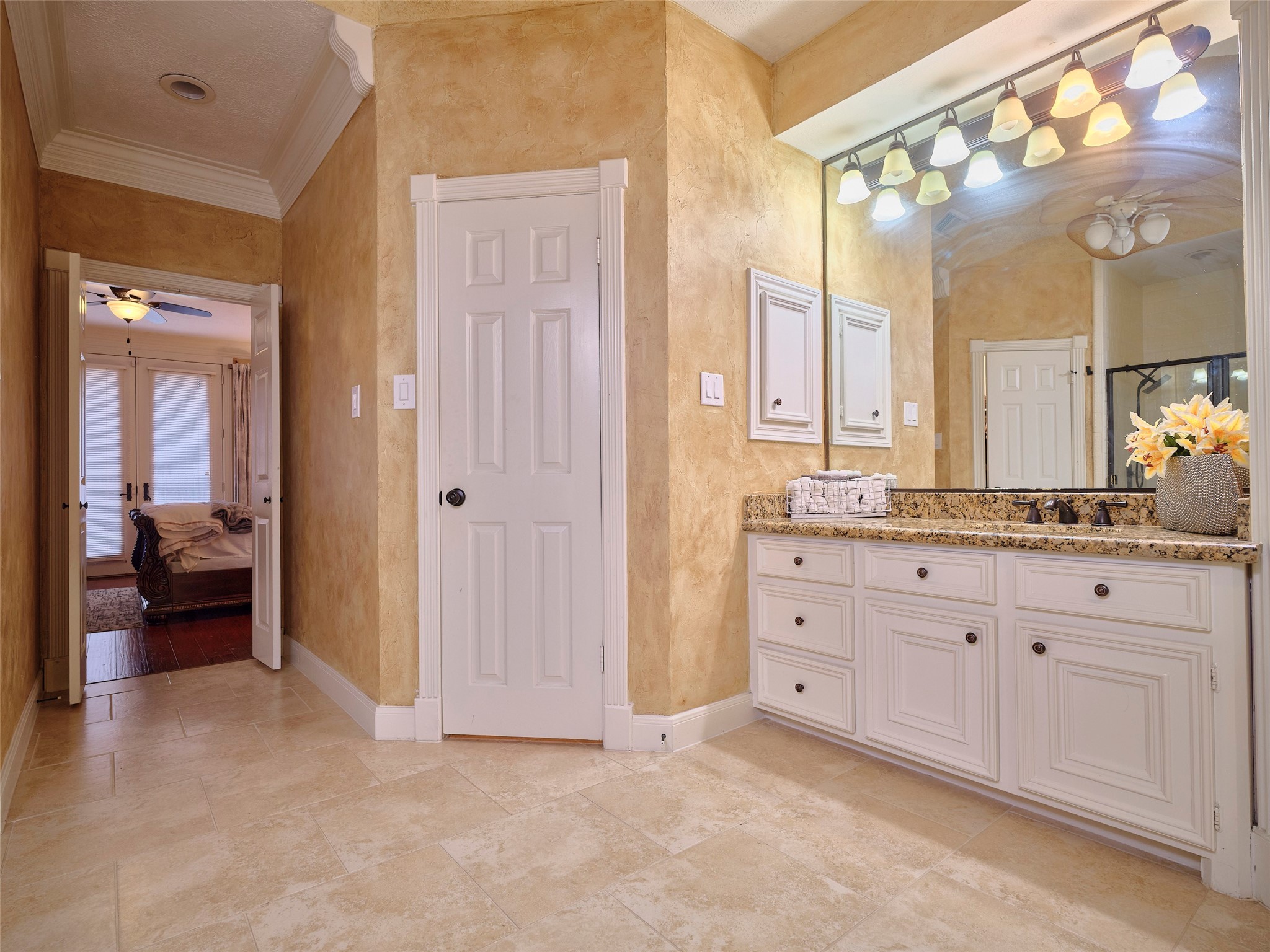 16623 Manningtree Lane Spring, TX 77379 - Photo 24 of 39 a spacious bathroom with a granite countertop sink a mirror and a