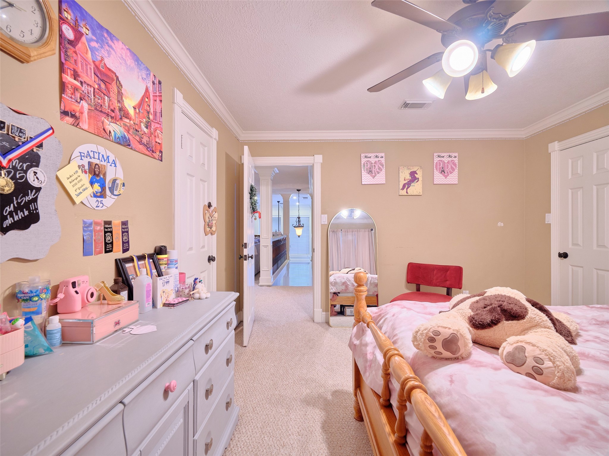 16623 Manningtree Lane Spring, TX 77379 - Photo 33 of 39 a bedroom with a bed and a chandelier