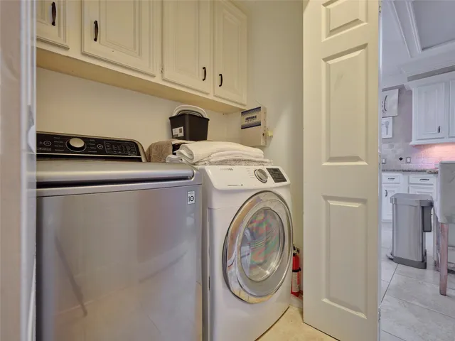 a bathroom with a granite countertop toilet sink and mirror