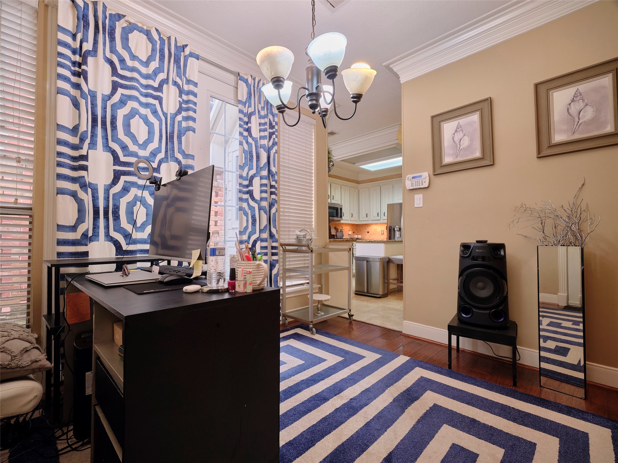 16623 Manningtree Lane Spring, TX 77379 - Photo 8 of 39 a living room with furniture and a chandelier