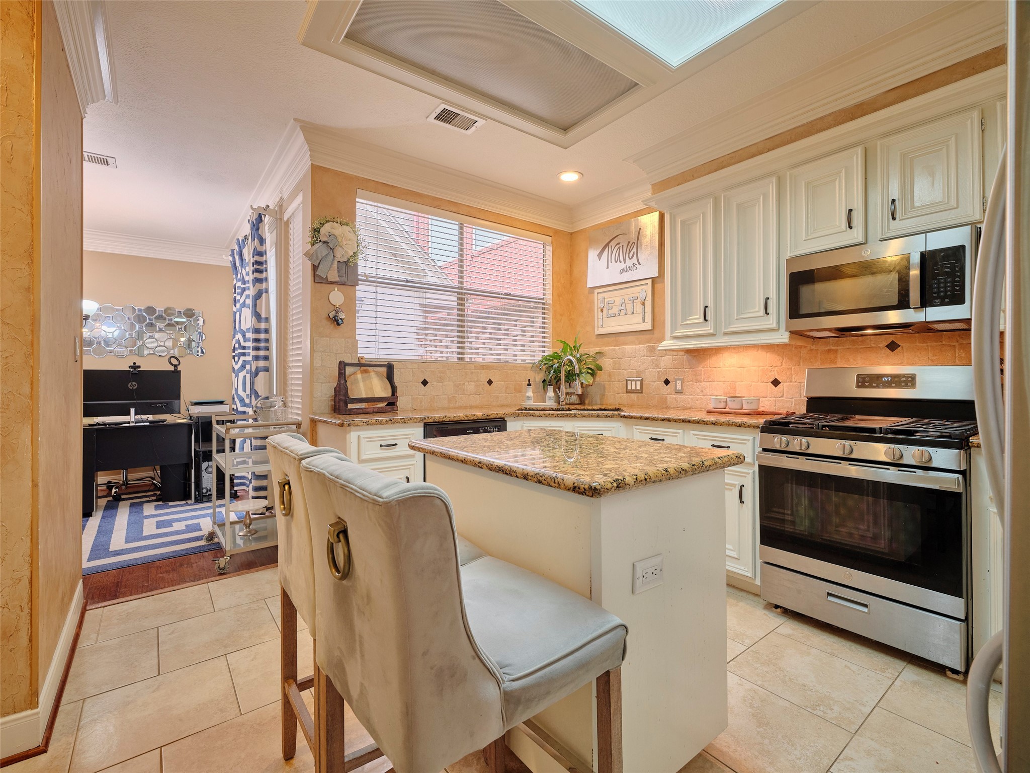 16623 Manningtree Lane Spring, TX 77379 - Photo 10 of 39 a kitchen with stainless steel appliances granite countertop a stove top oven a sink and a refrigerator