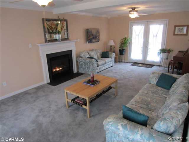 3508 Pease Road Midlothian, VA 23112 - Photo 2 of 12 a living room with furniture and a fireplace
