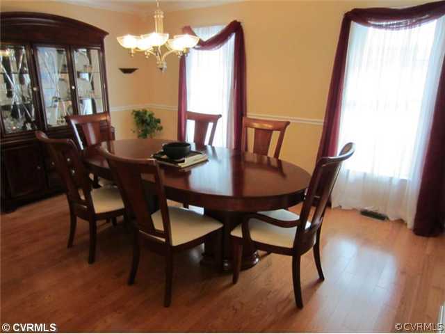 3508 Pease Road Midlothian, VA 23112 - Photo 4 of 12 a view of a dining room with furniture and wooden floor