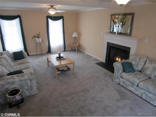 3508 Pease Road Midlothian, VA 23112 - Photo 5 of 12 a living room with furniture and a fireplace