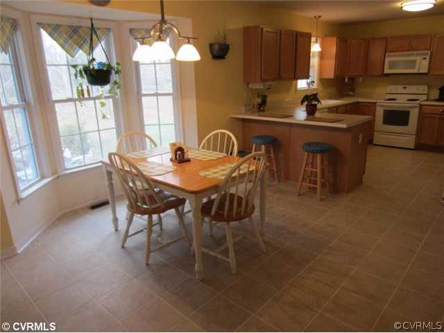 3508 Pease Road Midlothian, VA 23112 - Photo 6 of 12 a view of a dining room with furniture window and outside view