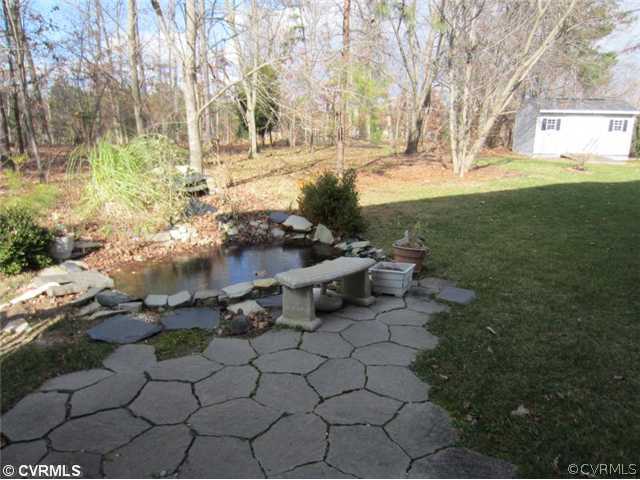 3508 Pease Road Midlothian, VA 23112 - Photo 10 of 12 a view of a yard with plants and trees