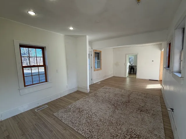 a view of livingroom with hardwood floor and hallway