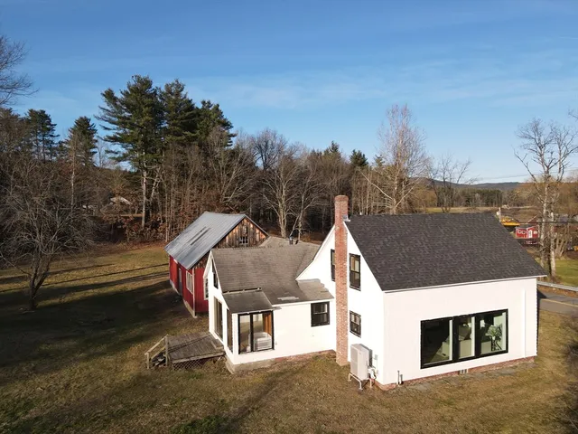 an aerial view of houses with trees
