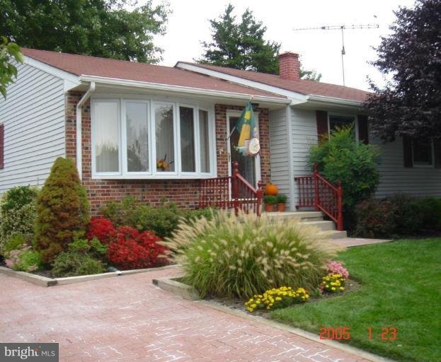 9118 Kilbride Road Nottingham, MD 21236 - Photo 1 of 22 a front view of a house with a yard
