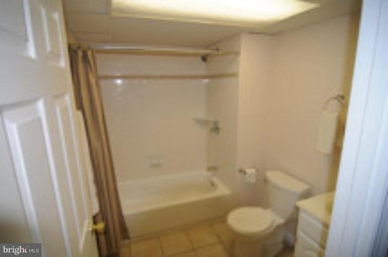 9118 Kilbride Road Nottingham, MD 21236 - Photo 13 of 22 a bathroom with a shower and a toilet