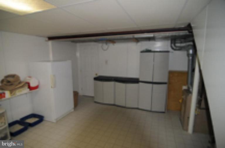 9118 Kilbride Road Nottingham, MD 21236 - Photo 14 of 22 a view of storage and utility room with a refrigerator
