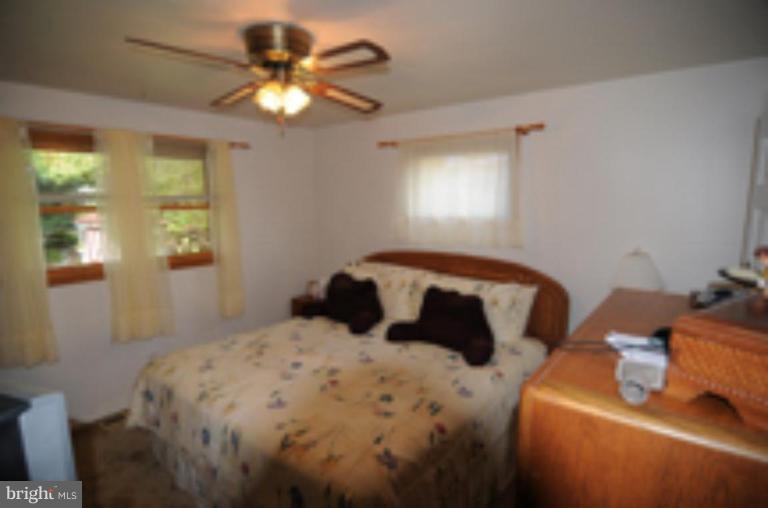 9118 Kilbride Road Nottingham, MD 21236 - Photo 8 of 22 a bedroom with a bed and window