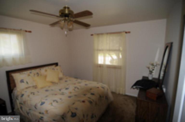 9118 Kilbride Road Nottingham, MD 21236 - Photo 9 of 22 a bedroom with a bed and a window