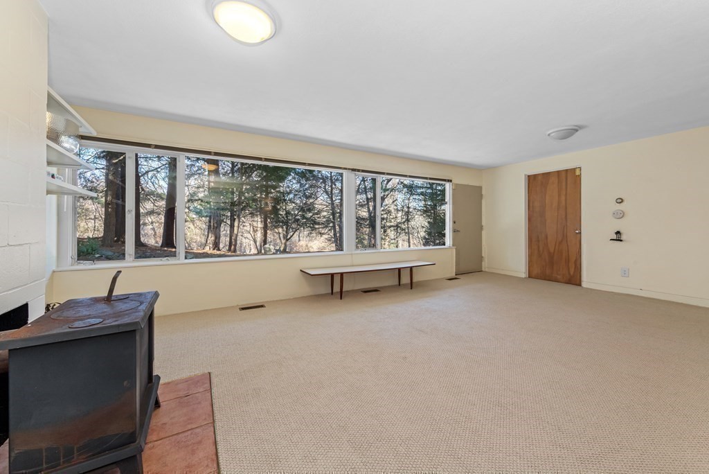 5 Field Road Lexington, MA 02421 - Photo 17 of 31 a view of an empty room with a window
