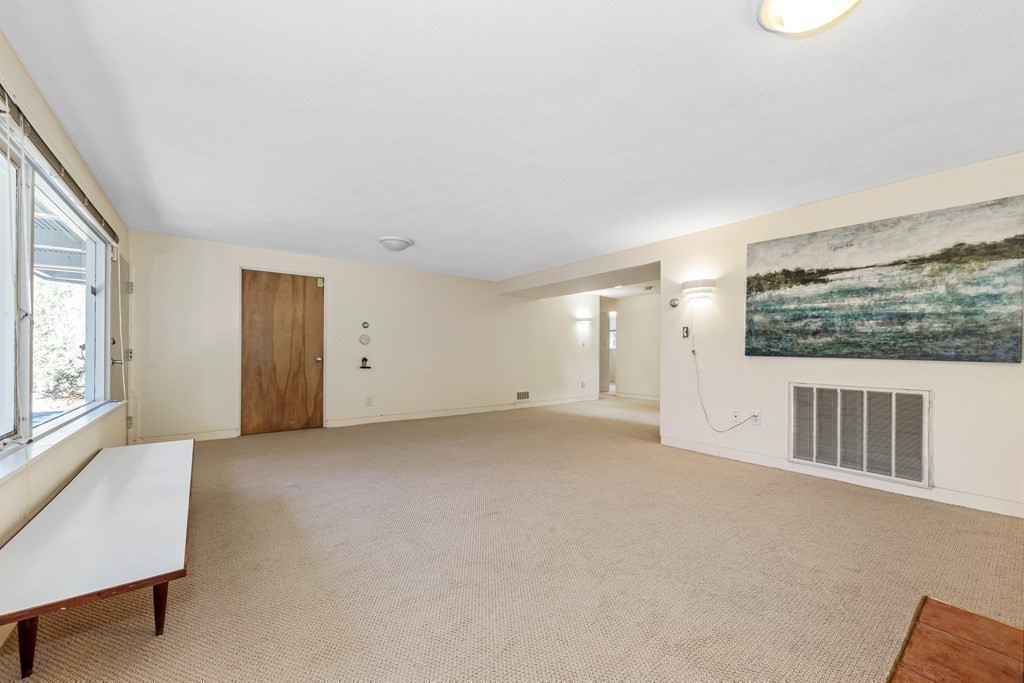 5 Field Road Lexington, MA 02421 - Photo 18 of 31 a view of an empty room with a window