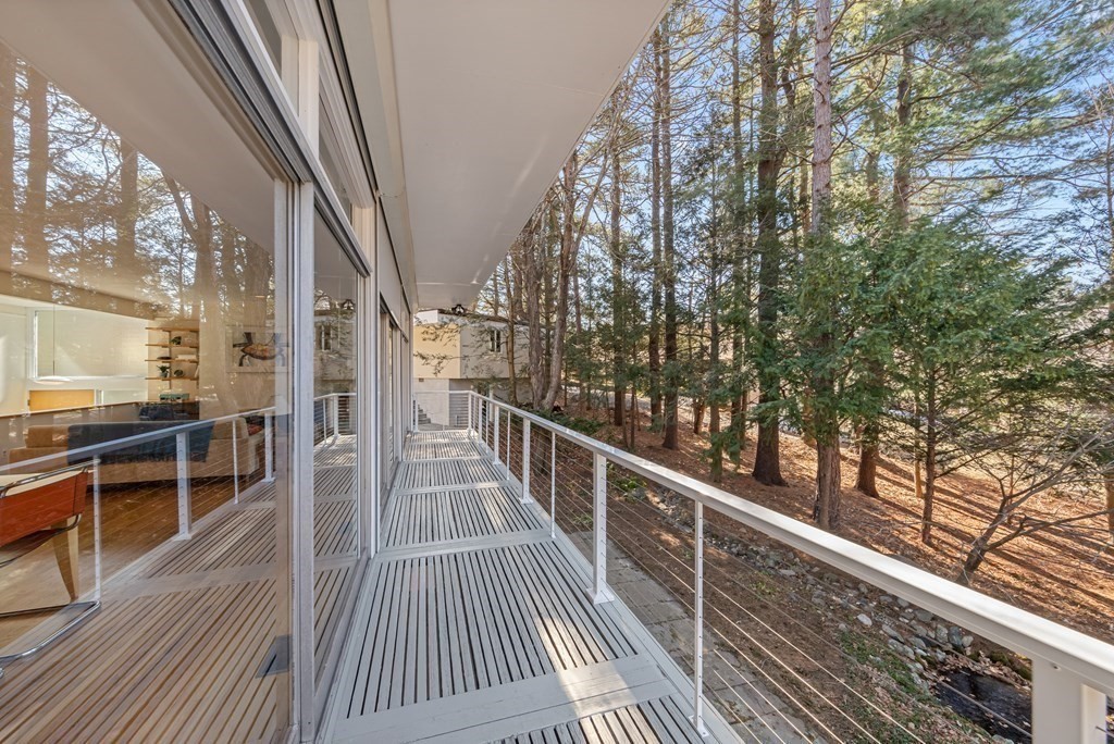 5 Field Road Lexington, MA 02421 - Photo 21 of 31 a view of balcony with wooden floor and seating