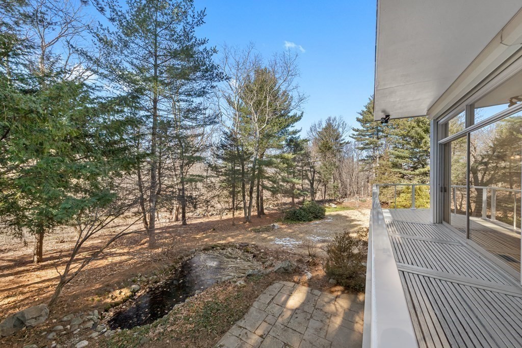 5 Field Road Lexington, MA 02421 - Photo 22 of 31 a view of a yard with trees