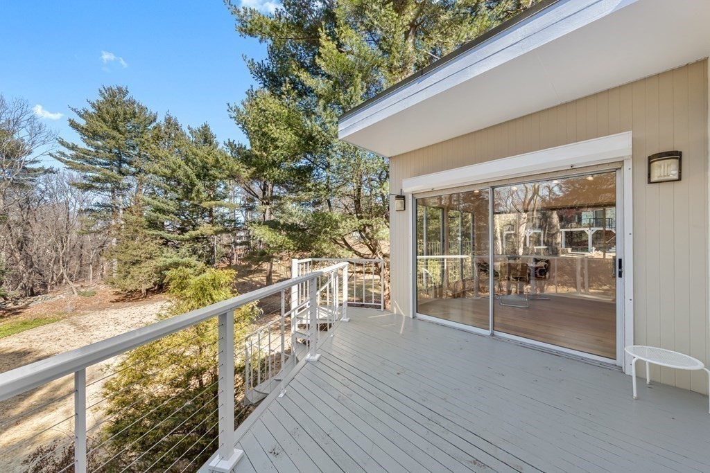 5 Field Road Lexington, MA 02421 - Photo 25 of 31 a view of a balcony with wooden floor and outdoor space