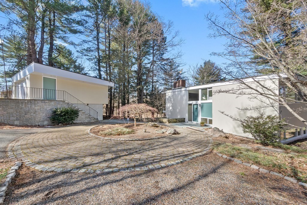 5 Field Road Lexington, MA 02421 - Photo 29 of 31 a view of a house with snow on the side of the road