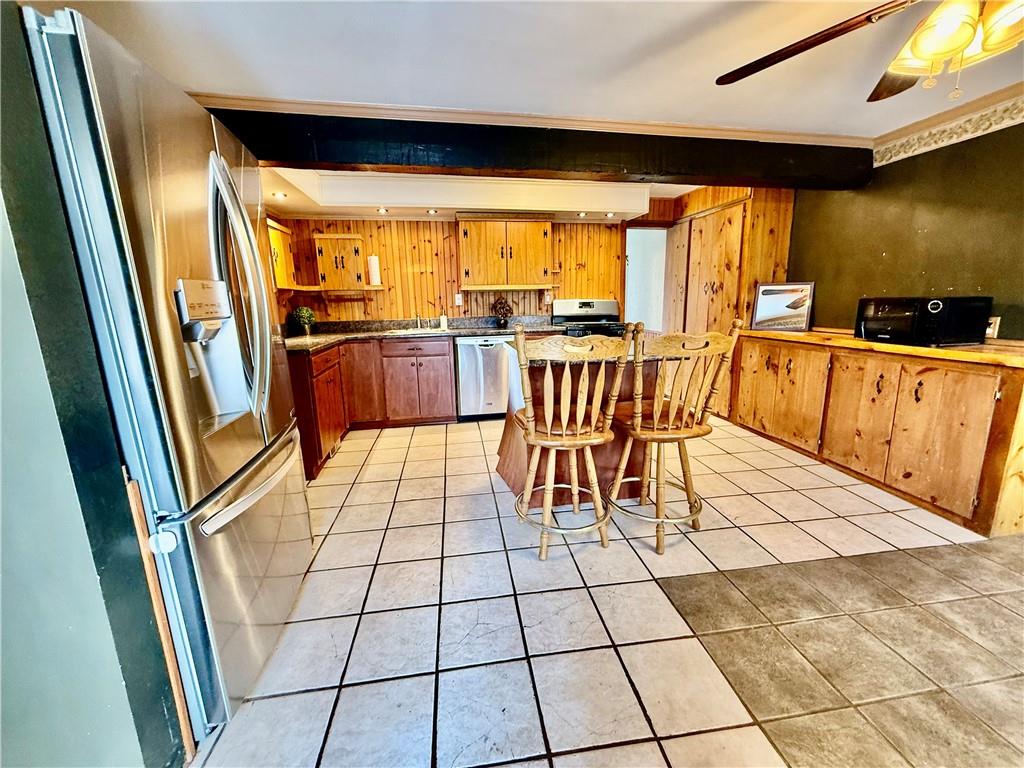 2298 Evergreen Road Pittsburgh, PA 15237 - Photo 3 of 29 When you enter in the home you will see this love kitchen with SS Appliances and Tiled Flooring.