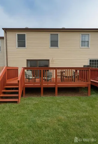 a view of a deck yard with a house