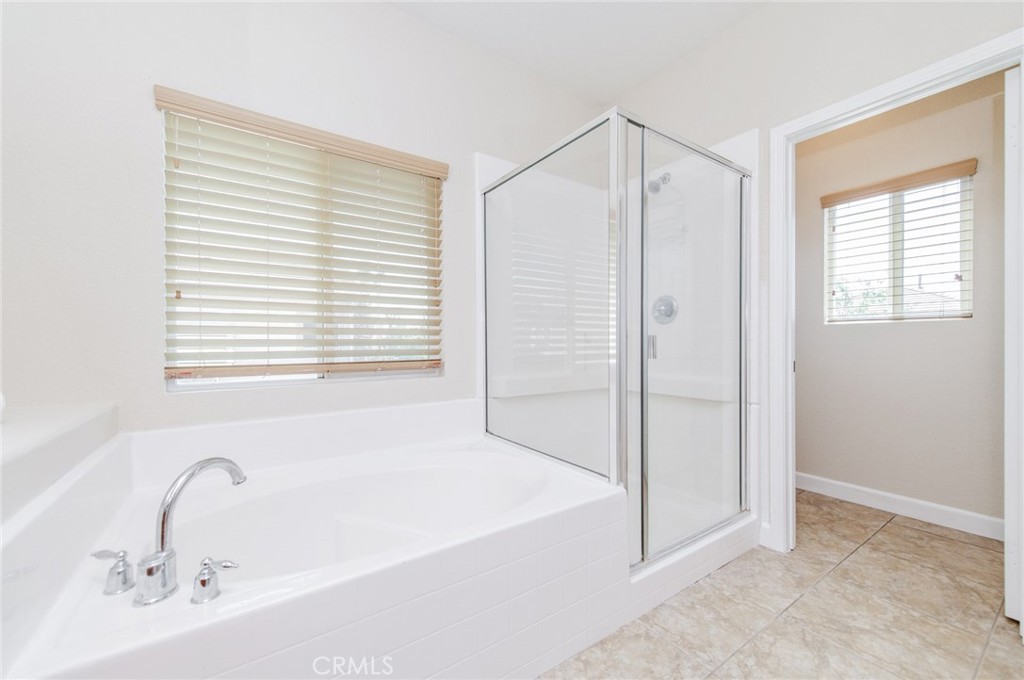 4947 Plumtree Court Riverside, CA 92504 - Photo 27 of 46 Dual sinks, soaking tub, and separate shower