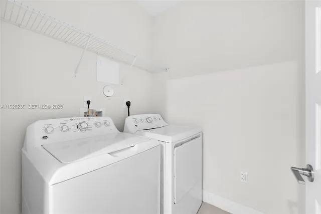 a view of a balcony with wooden floor and fence