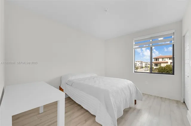 a view of buildings with a garden