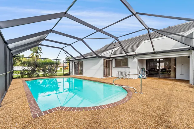 a view of a swimming pool with a patio