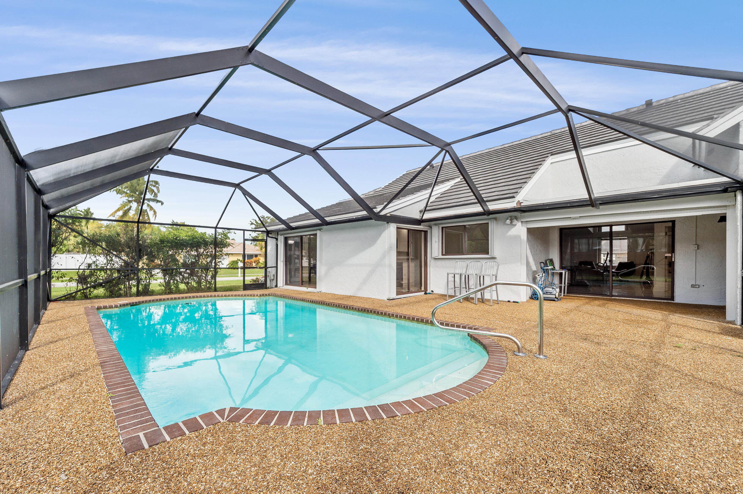 22301 Ensenada Way Boca Raton, FL 33433 - Photo 11 of 44 a view of a swimming pool with a patio