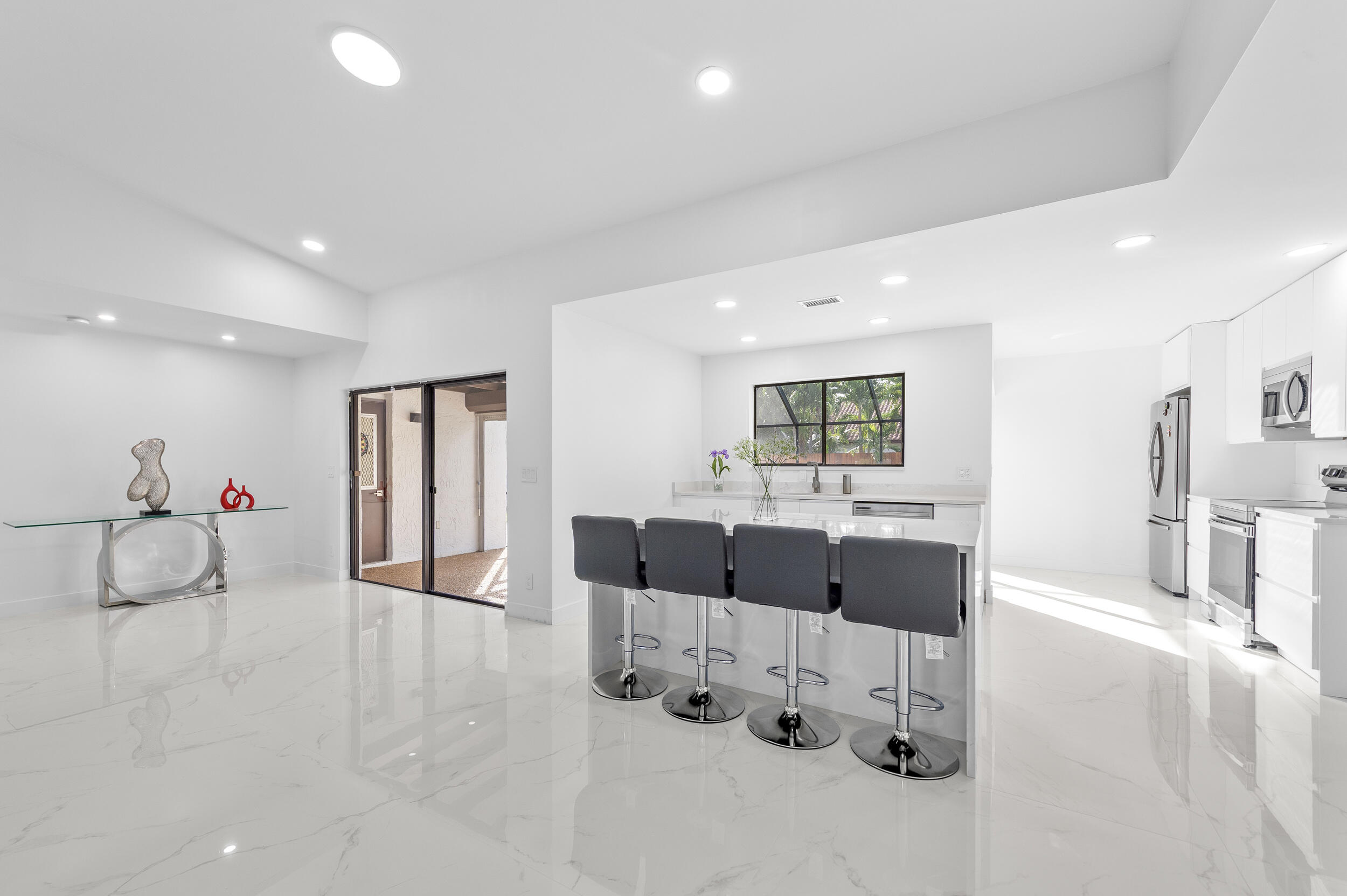 22301 Ensenada Way Boca Raton, FL 33433 - Photo 16 of 44 a living room with furniture and a wooden floor