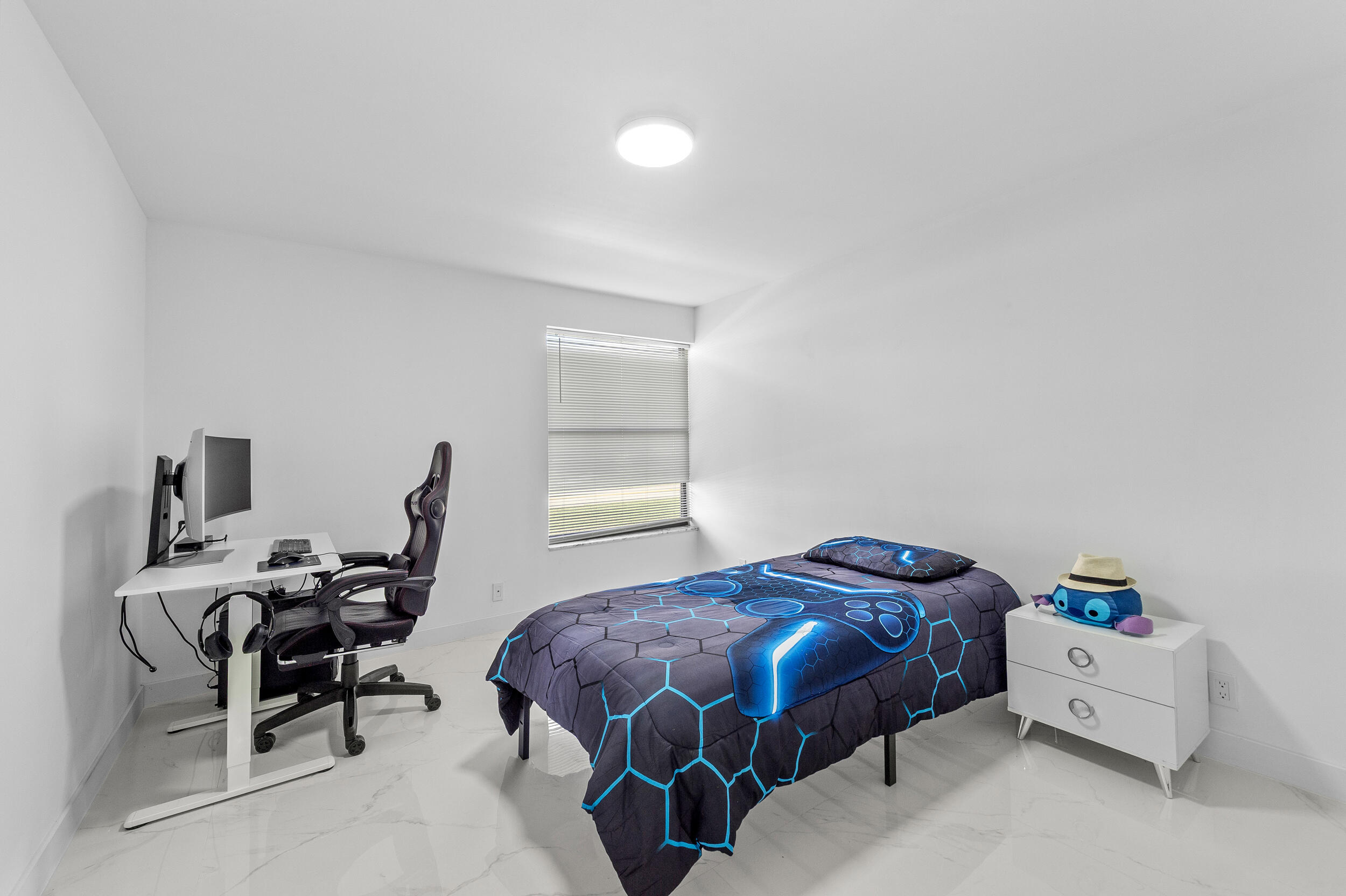 22301 Ensenada Way Boca Raton, FL 33433 - Photo 23 of 44 a bedroom with a bed and wooden floor