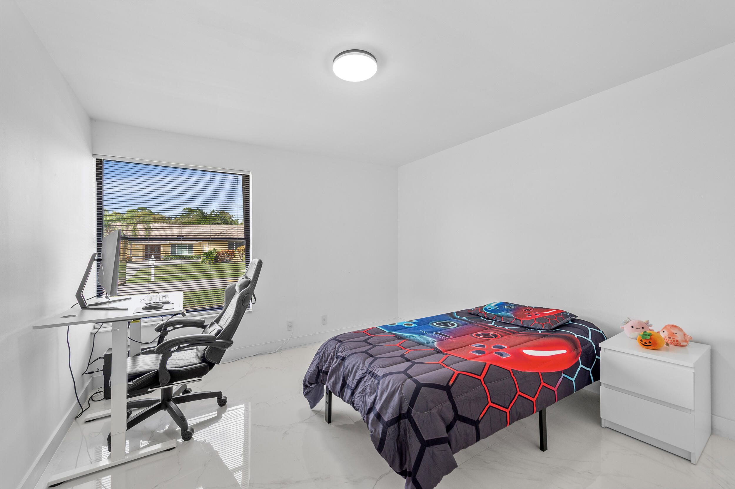 22301 Ensenada Way Boca Raton, FL 33433 - Photo 24 of 44 a bedroom with a bed and a table