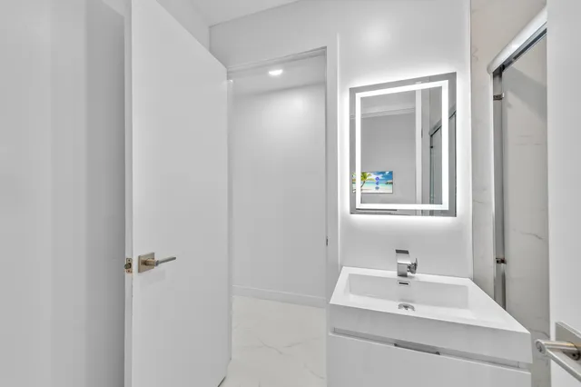 a bathroom with a sink and a mirror