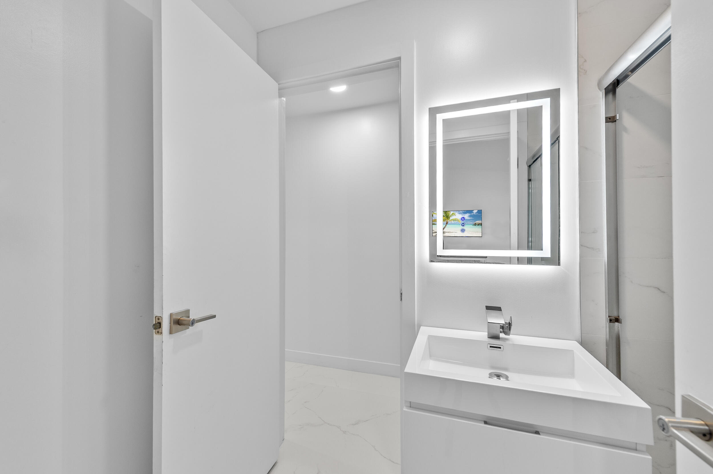 22301 Ensenada Way Boca Raton, FL 33433 - Photo 26 of 44 a bathroom with a sink and a mirror